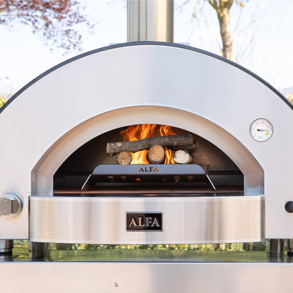 Alfa Forni Classico 4 Pizze Hybrid Oven With Wood Fire Burning Inside On Wood Holder