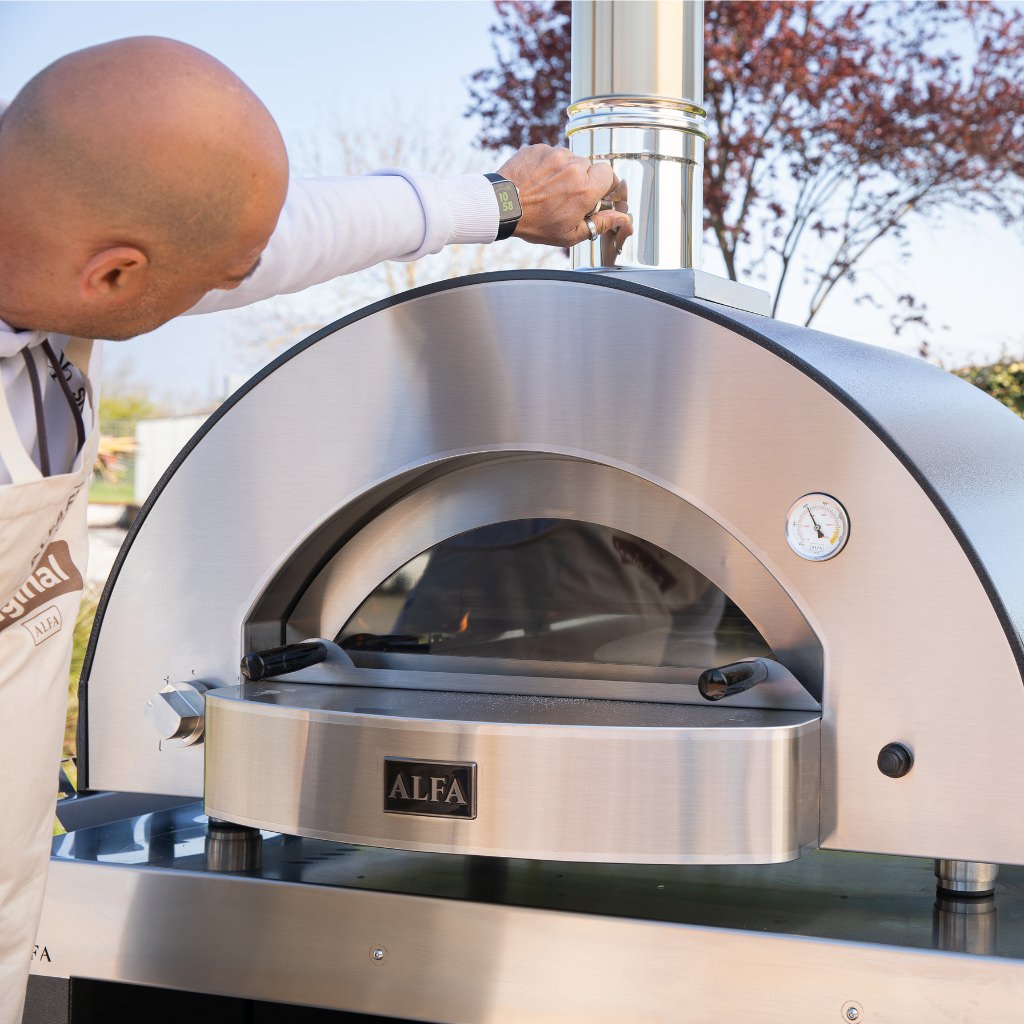 Man Turning Butterfly Valve For Low and Slow Kit to Cook Bread in His Forno Alfa Classico 4 Pizze Oven