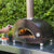 Alfa One Nano Wood Fired Pizza Oven Cooking Pizza On Countertop