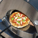 Pulling a cooked Margherita pizza out of the Alfa Forni Classico 2 Pizza Gas Oven