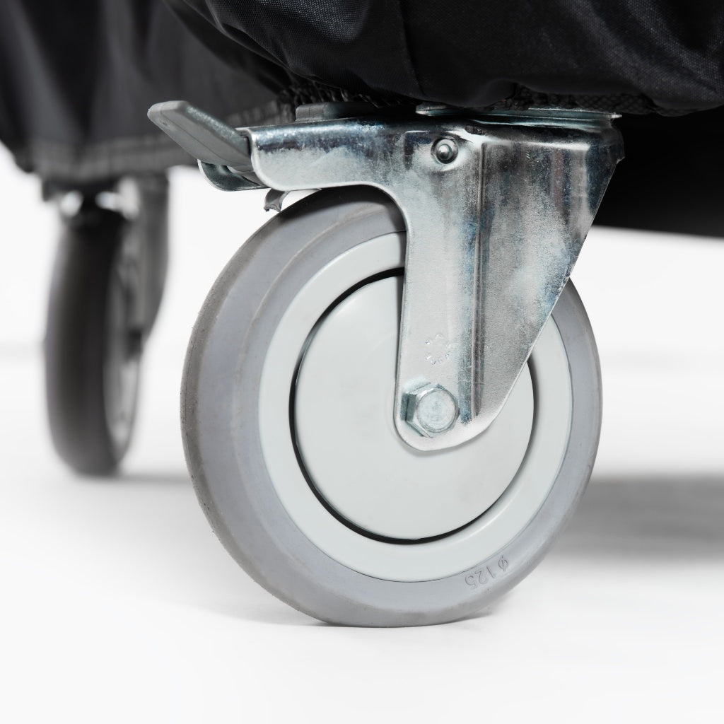 Alfa Ciao Cover close-up of bottom of cover fitting around top of caster wheel with a metal brake on a white background