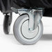 Alfa Ciao Cover close-up of bottom of cover fitting around top of caster wheel with a metal brake on a white background