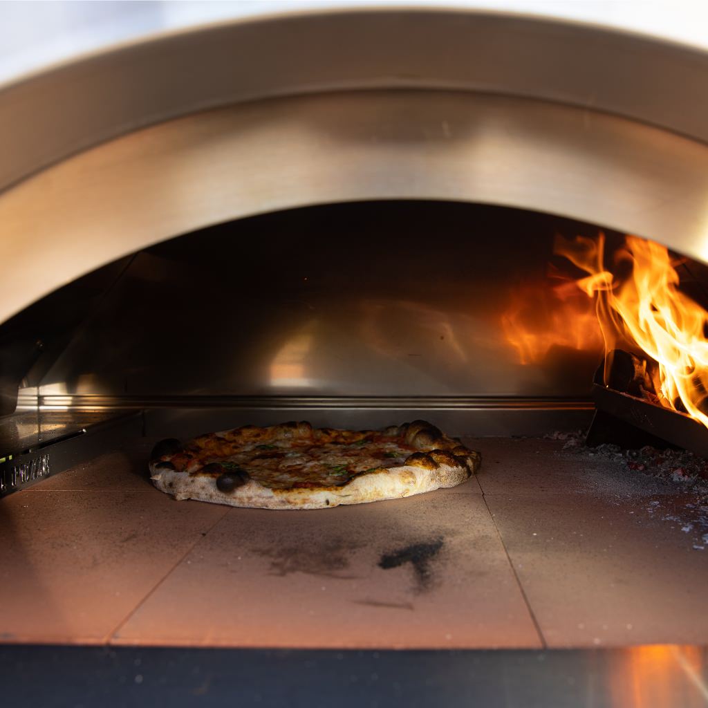Alfa Hybrid Kit inside oven with pizza baking and with flames visible