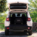 Alfa Moderno Portable Cover on the oven in the back of a white SUV with open trunk in a natural setting