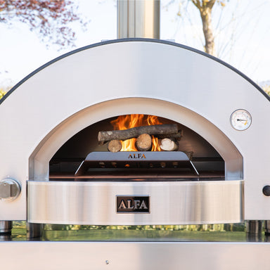 Alfa Wood Rack in outdoor pizza oven with fire burning inside.