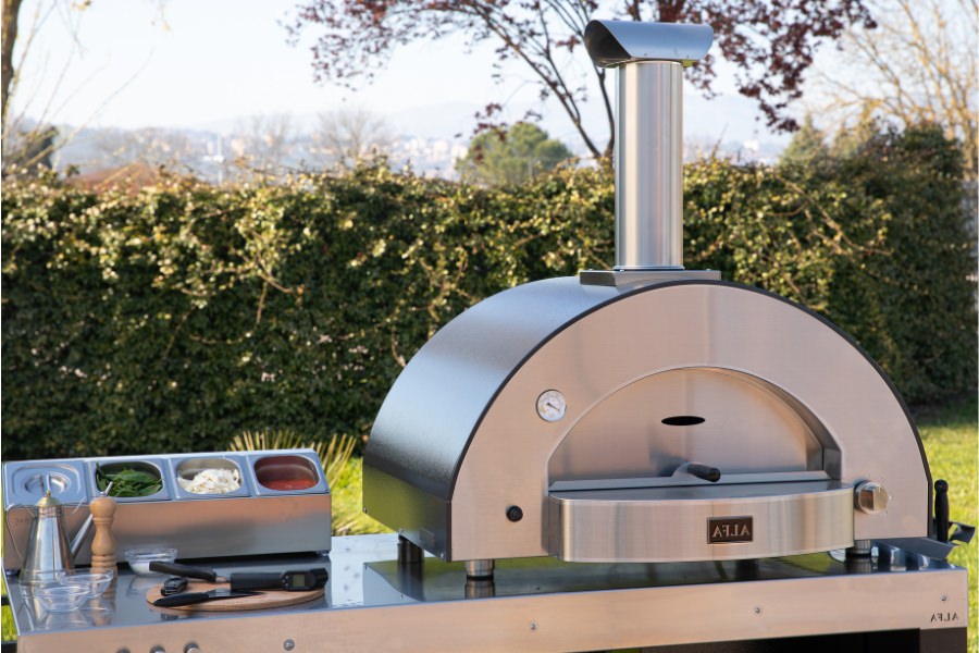 Forno Alfa Classico 4 Pizze Gas Pizza Oven In Backyard On Table