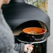 Polito Giotta Pizza Oven cooking soup in ceramic baking bowl