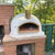 Authentic Pizza Ovens Pizzaioli Custom Wood Fired Pizza Oven in Backyard on Brick Base