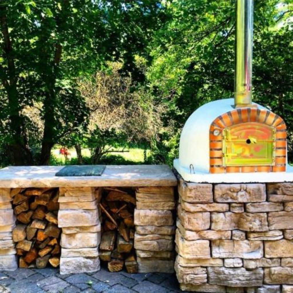 https://propizzaovens.com/cdn/shop/products/Authentic_Pizza_Ovens_Lisboa_Countertop_Wood_Fired_Pizza_Oven_On_Custom_Stone_Patio_Base.jpg?v=1608564857
