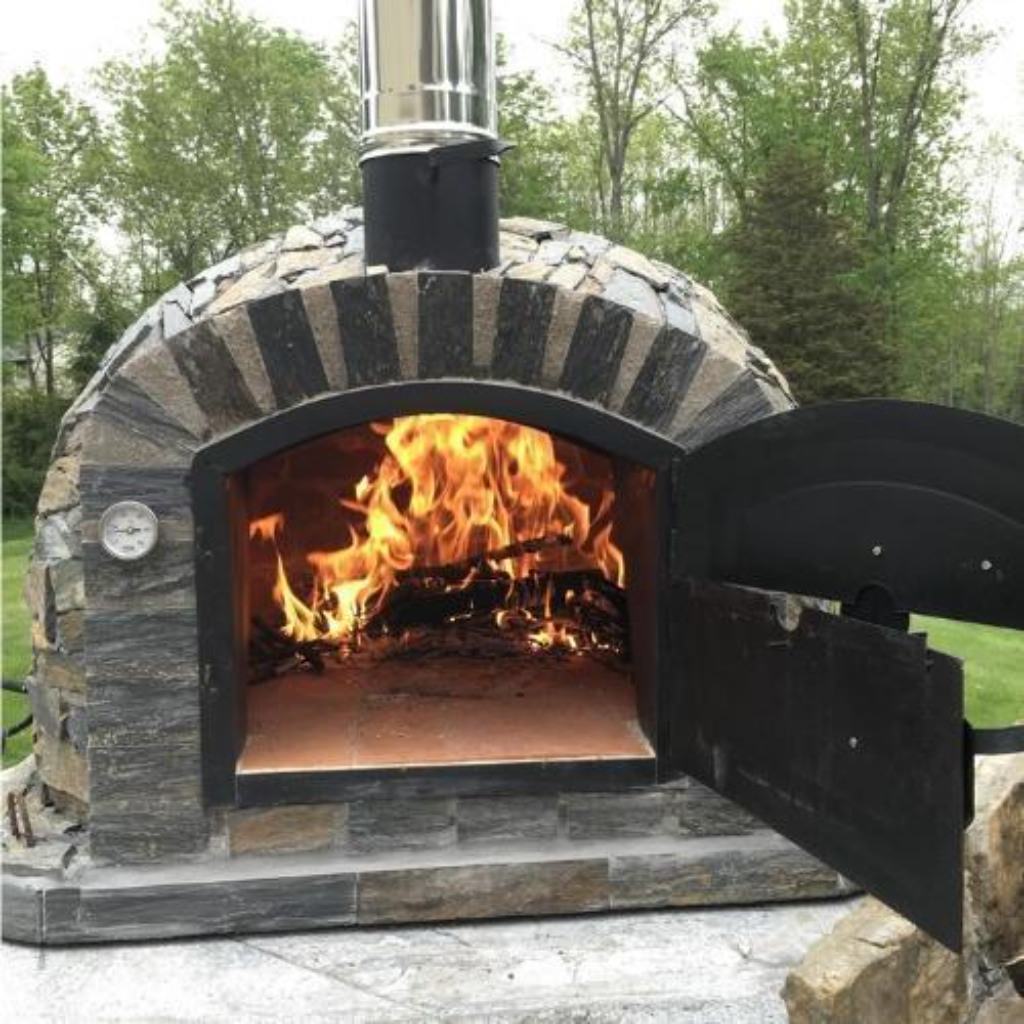 Authentic Pizza Ovens Premium Lisboa Stone Finish Countertop Wood Fired Pizza Oven on Outdoor Patio Custom Built Base with Fire Inside Oven and Both Doors Open