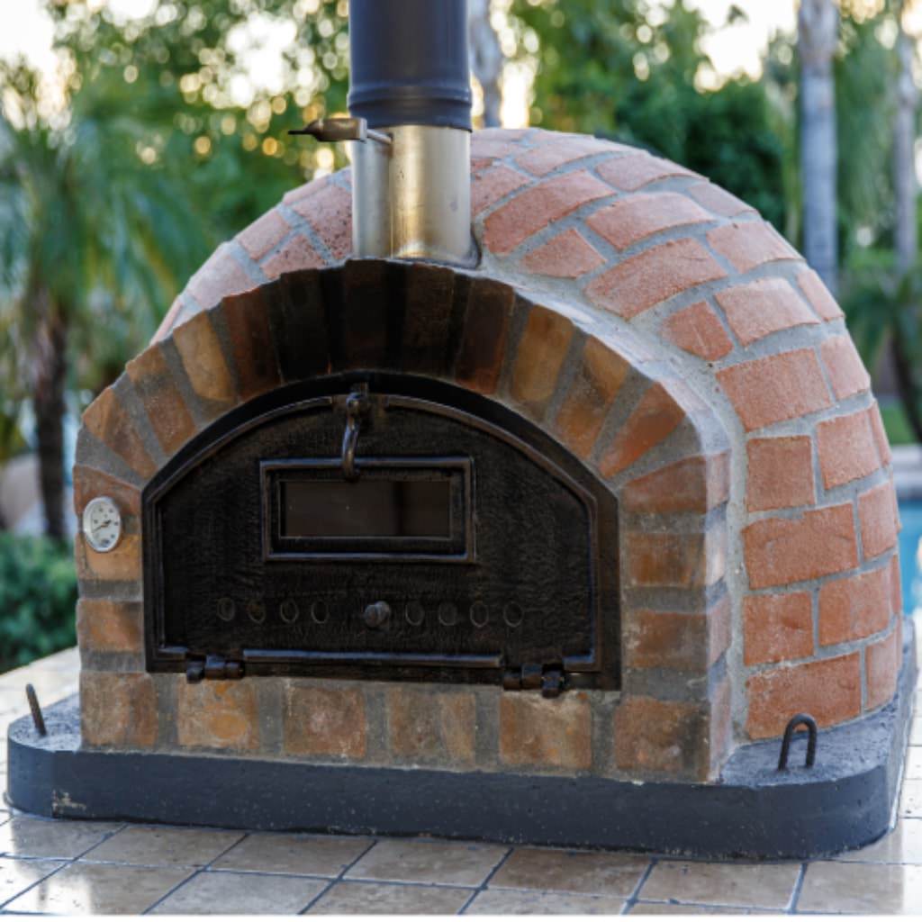 Authentic Pizza Ovens Premium Pizzaioli Rustic Finish Countertop Wood Fired Pizza Oven on Outdoor Patio in Summer