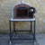Authentic Pizza Ovens Premium Ventura Red Brick Countertop Wood Fired Pizza Oven on Outside Patio on Black Stand with Both Doors Open Full View