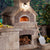Chicago Brick Oven CBO 1000 Commercial Wood Fired Pizza Oven Kit Custom Home Backyard Installation with Light Stone and Oven Door Open