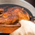 Chicago Brick Oven CBO 750 Countertop Wood Fired Pizza Oven Cooking Rotisserie Chicken in Clay Pan