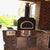 Chicago Brick Oven CBO 750 Hybrid Countertop Gas and Wood Fired Pizza Oven in Copper Vein in Custom Brick Outdoor Kitchen at Residential Home Back Porch