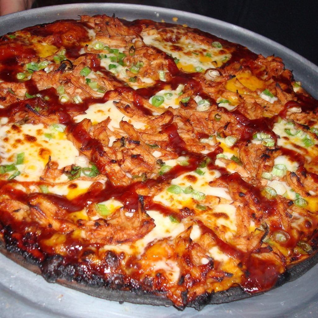 Chicago Brick Oven CBO 750 Wood Fired Pizza Oven DIY Kit Cooked Buffalo Chicken Pizza on Metal Serving Tray