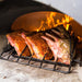 Chicago Brick Oven CBO 750 Wood Fired Pizza Oven DIY Kit Cooking Ribs with Oven Door Open and Wood Burning in the Oven